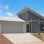 White house with White Roof — Roofing Services in Winnellie, NT