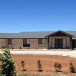 Black Roof Bungalow House — Roofing Services in Winnellie, NT