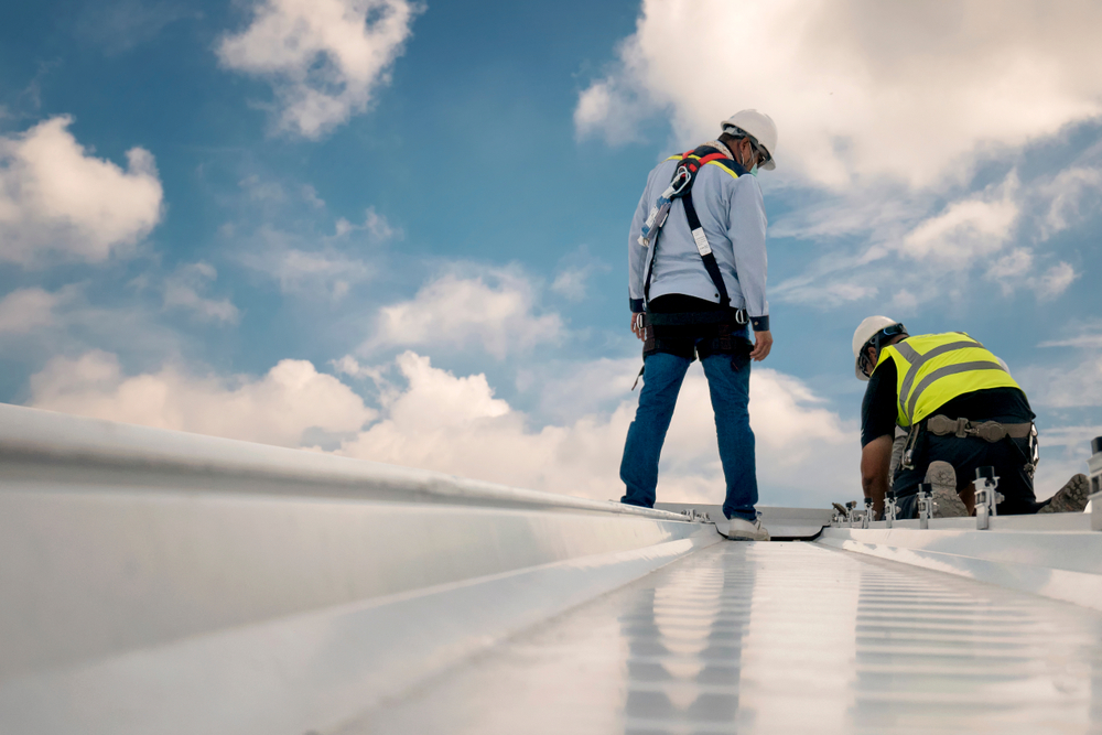 Two Man Inspecting Roof — Roofing Services in Winnellie, NT