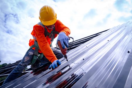 Installing Roofing on new building — Roofing Services in Winnellie, NT